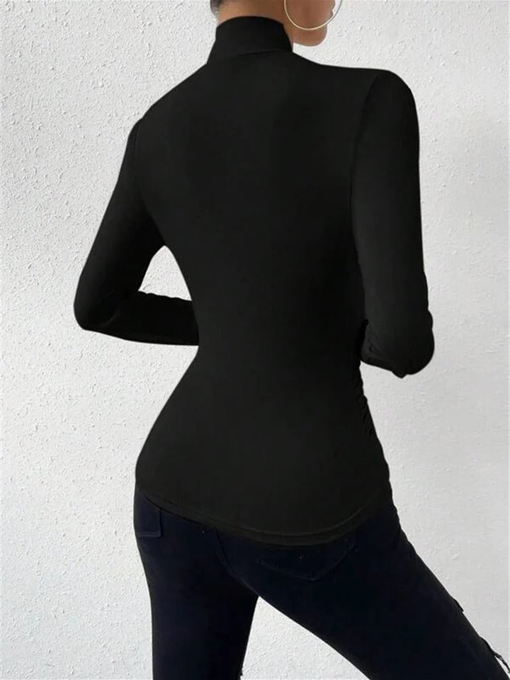 CELESTE | BLUSA PLISADA CON CUELLO CRUZADO